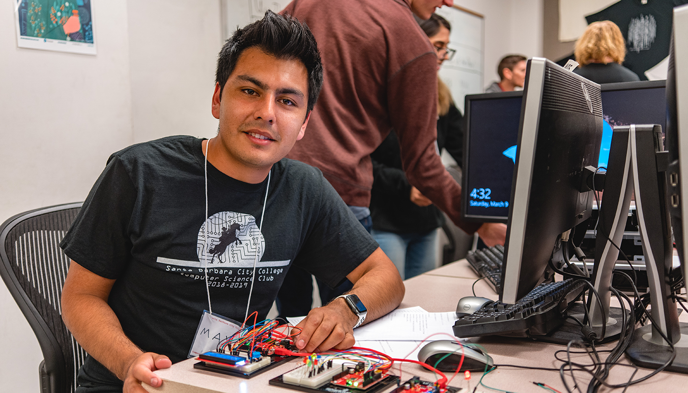 SBCC computer science student at a computer.