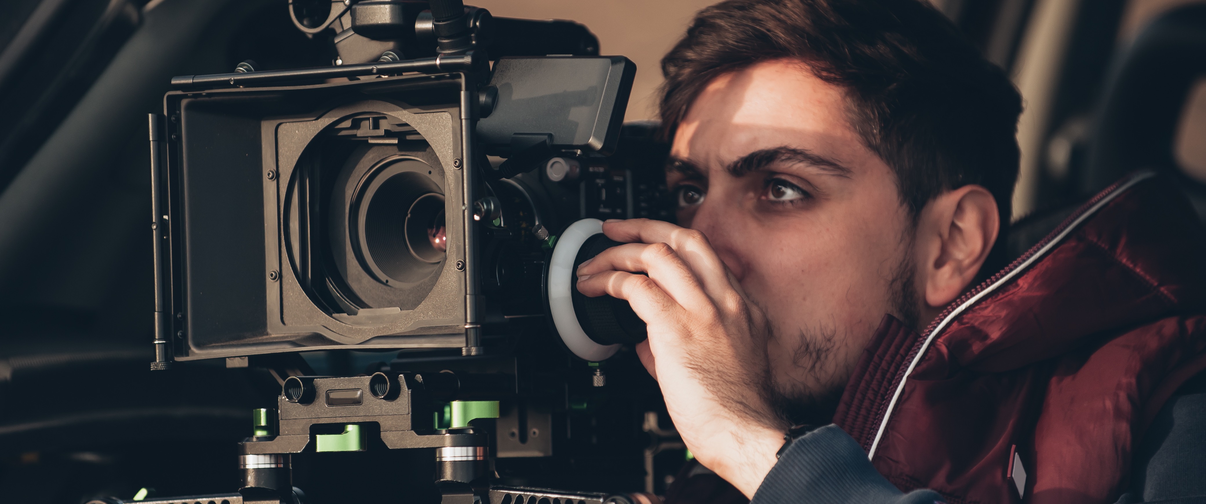 Student with camera shooting on location.